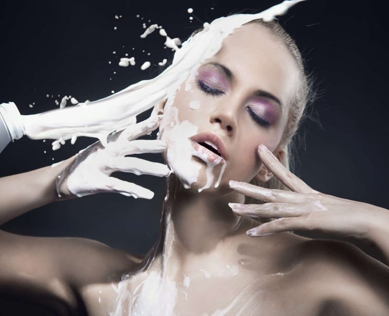 Portrait,Of,A,Beautiful,Blonde,Dousing,With,Cream