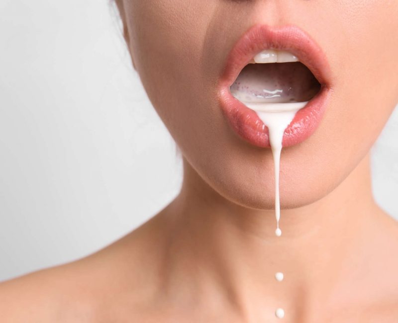 Young,Woman,With,White,Liquid,Dripping,From,Her,Mouth,On